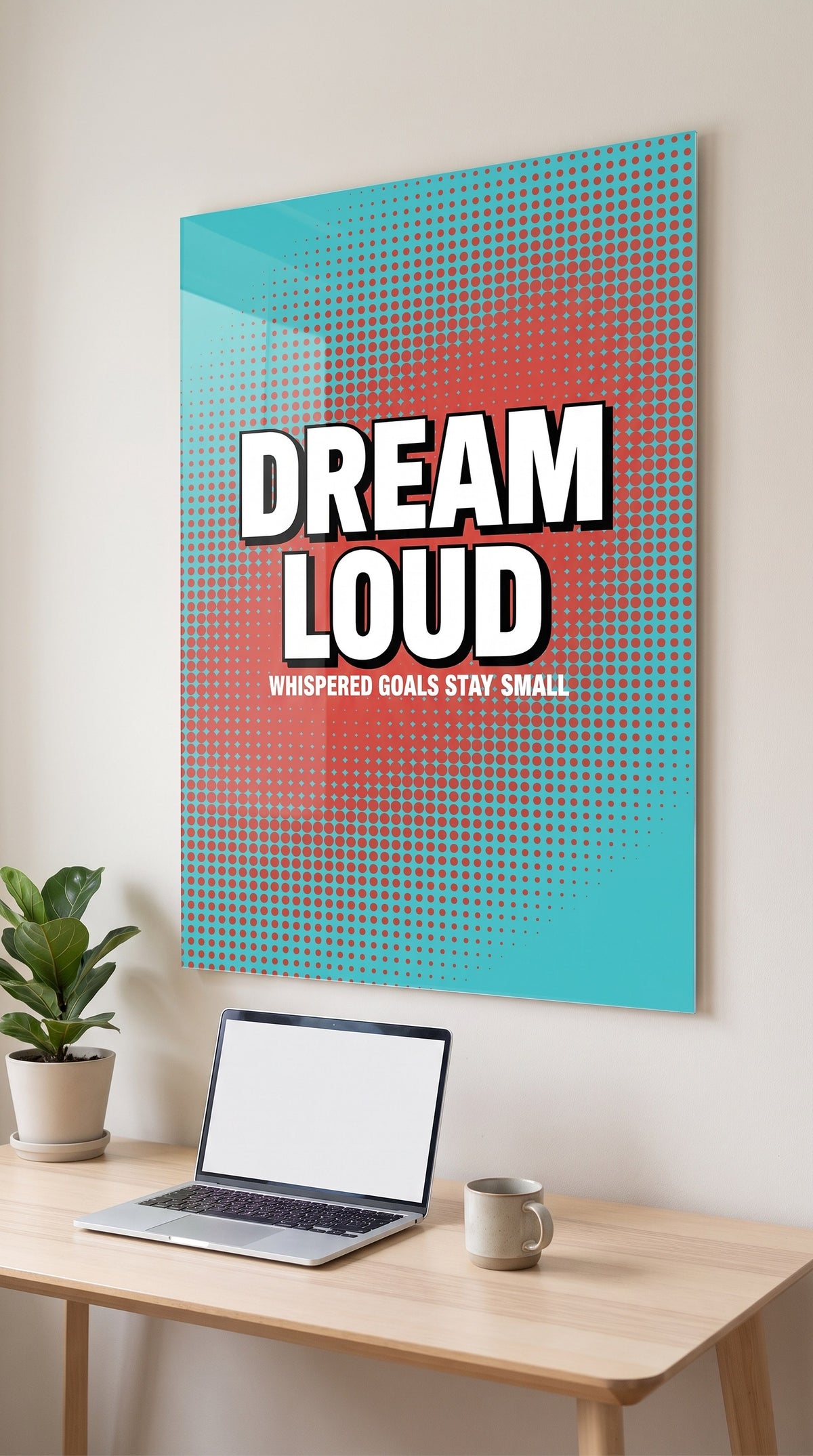 Dream Loud acrylic sign in a workspace