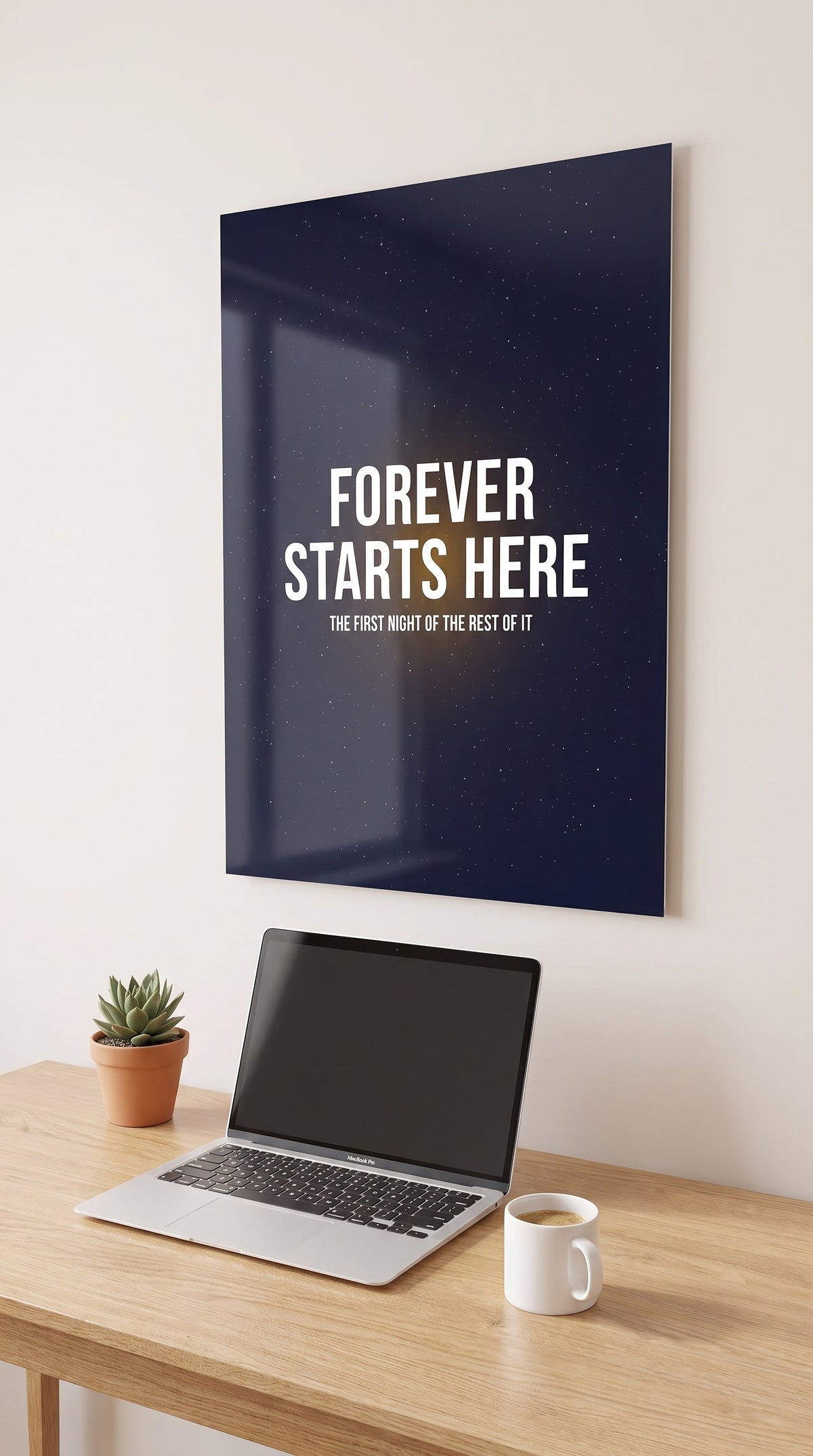 Forever Starts Here acrylic sign in a workspace
