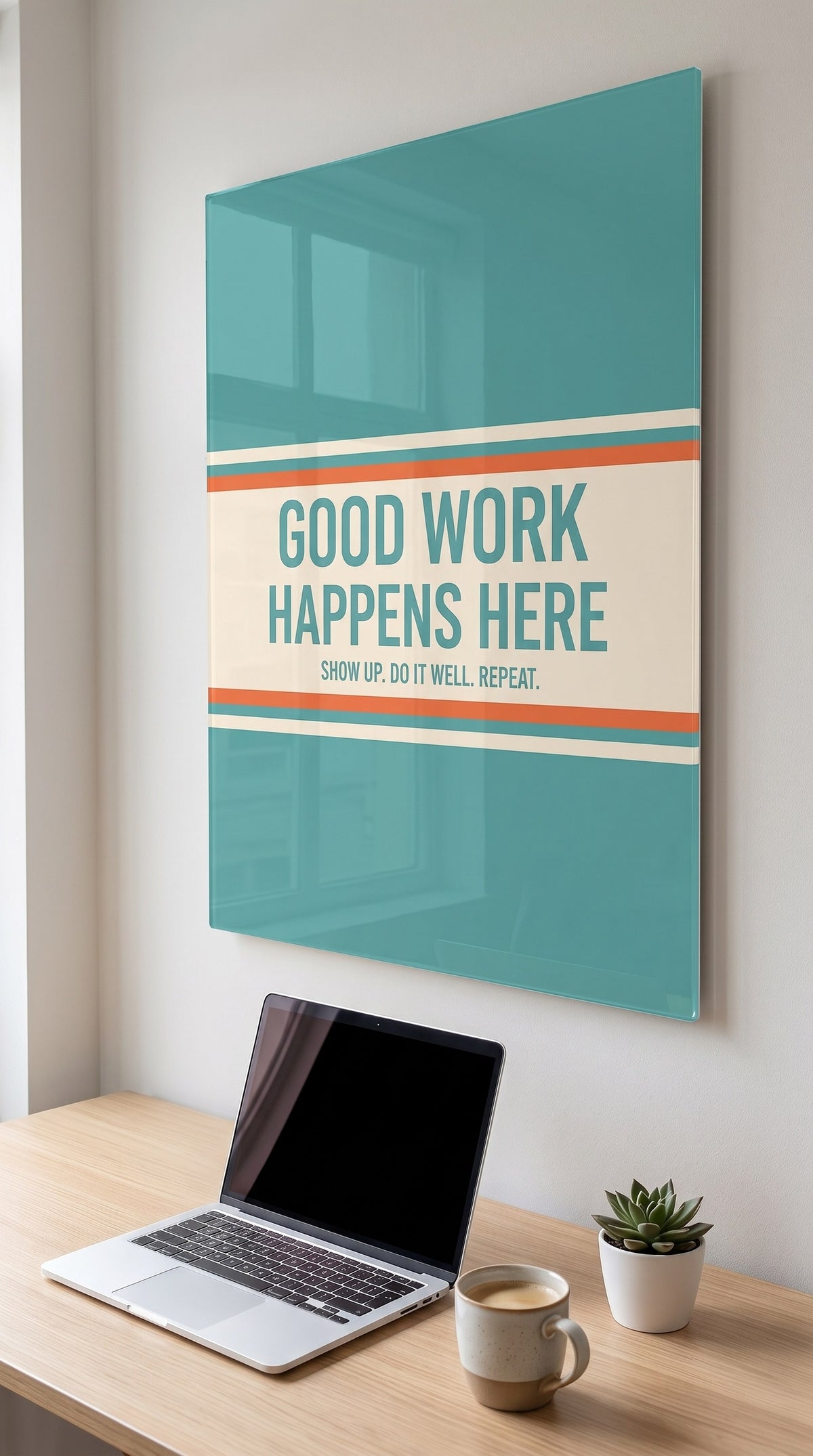 Good Work Happens Here acrylic sign in a workspace