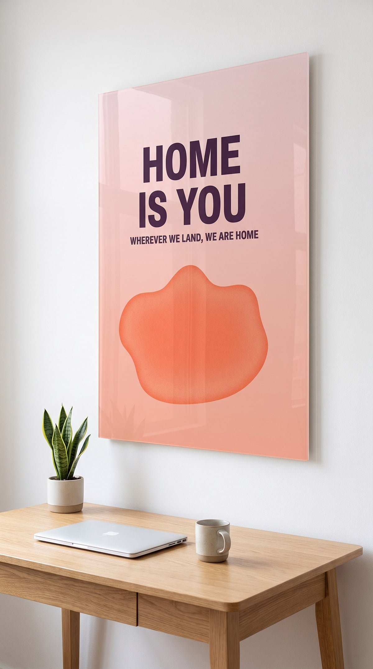 Home Is You acrylic sign in a workspace