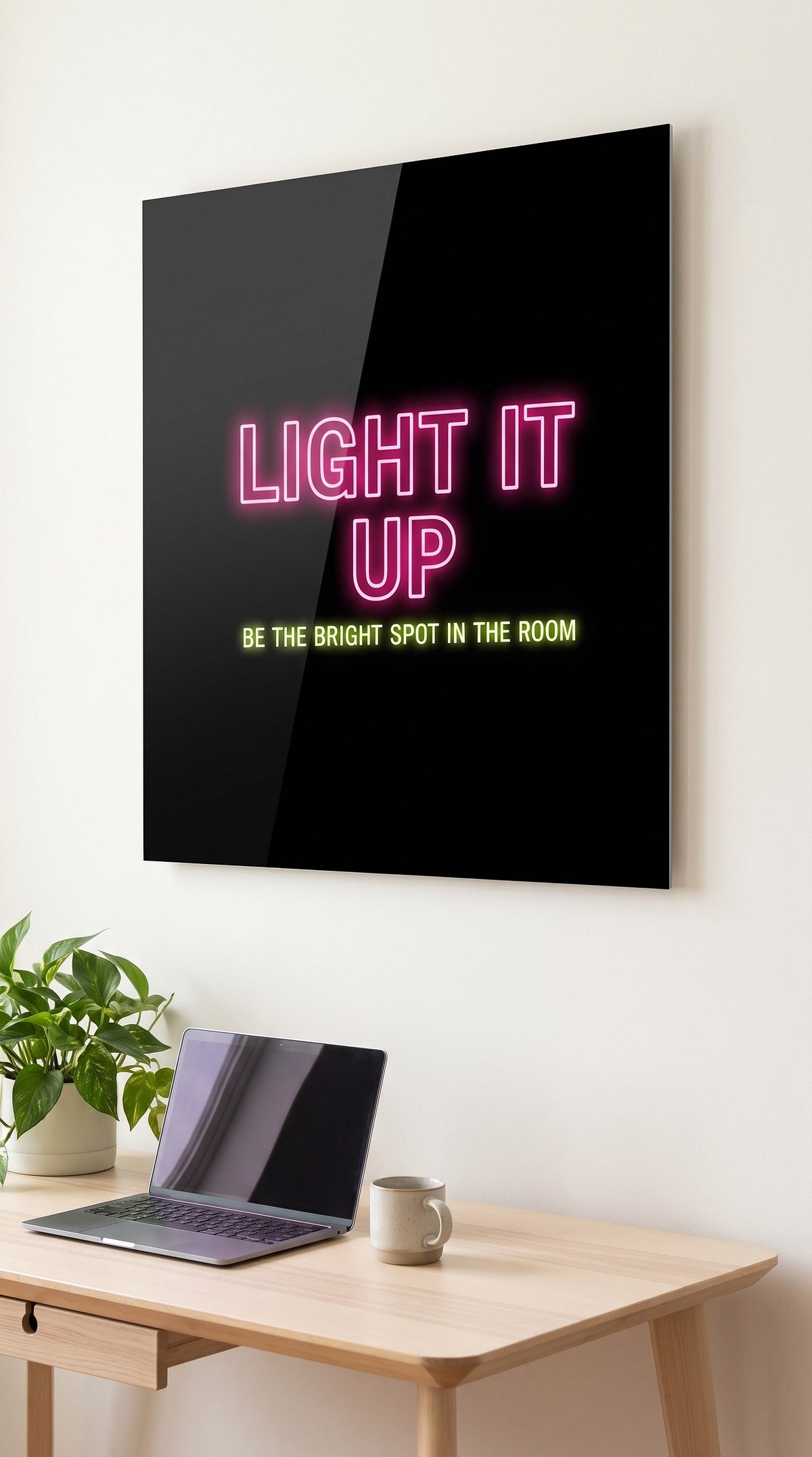 Light It Up acrylic sign in a workspace