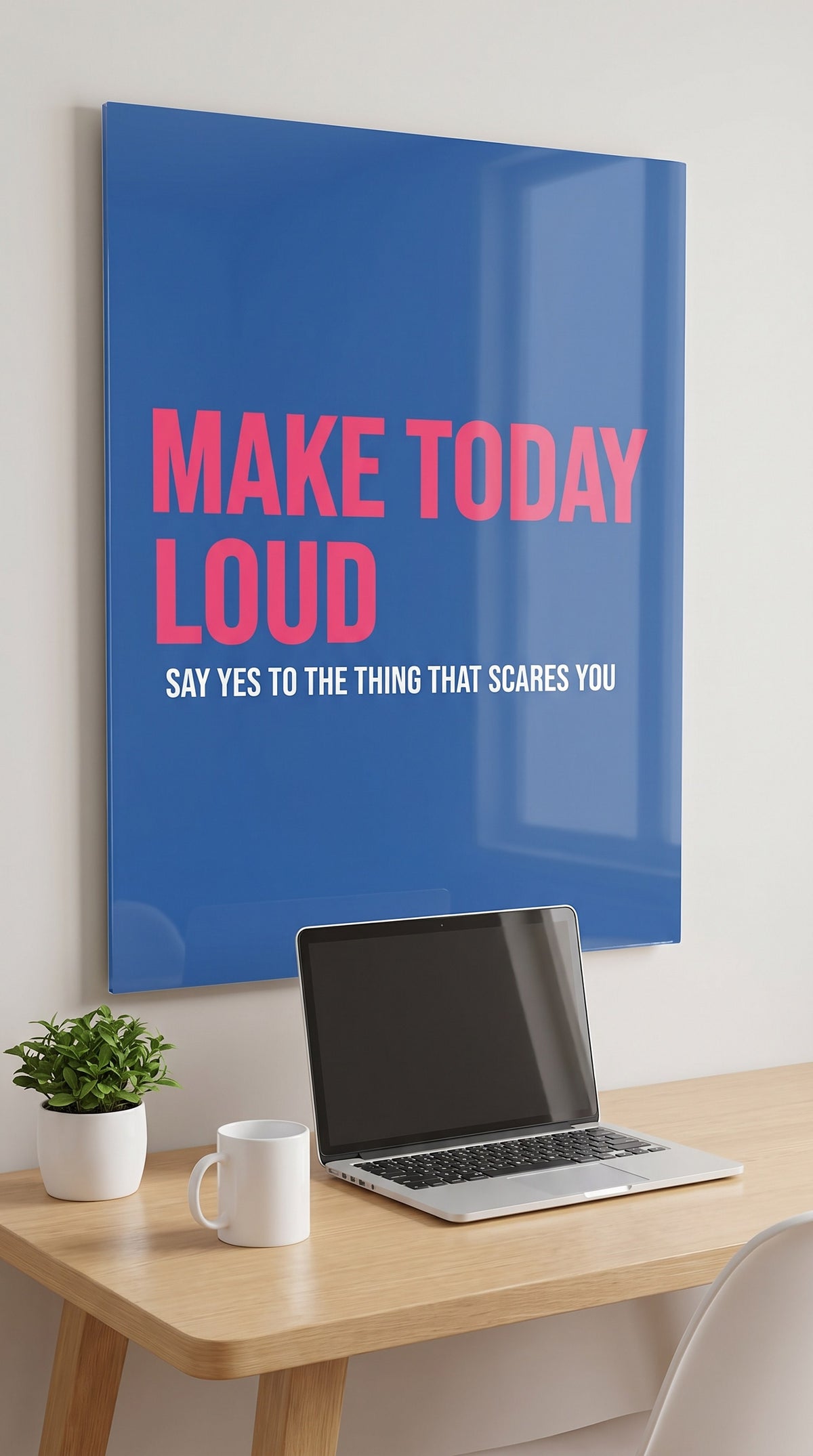 Make Today Loud acrylic sign in a workspace