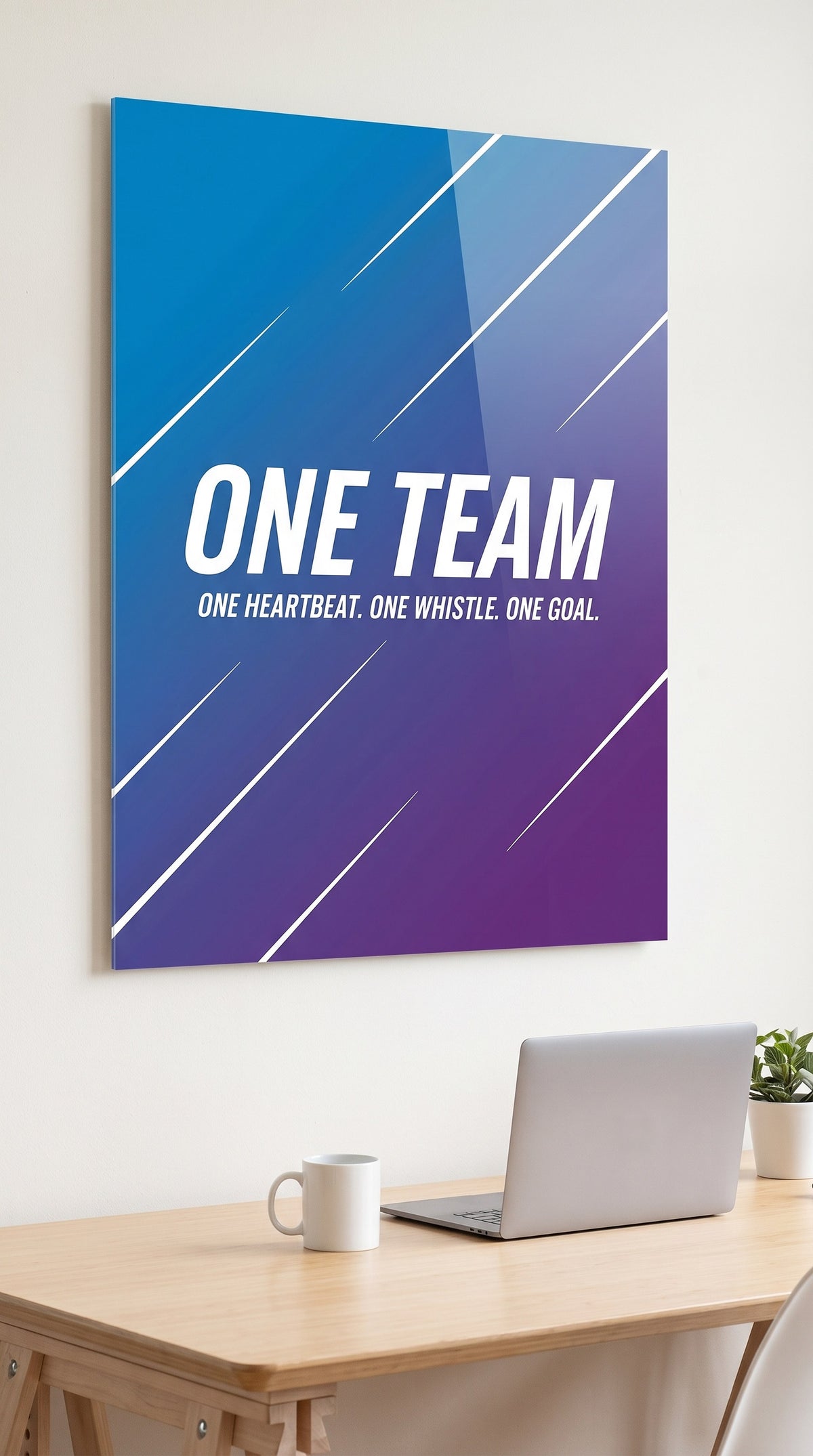 One Team acrylic sign in a workspace