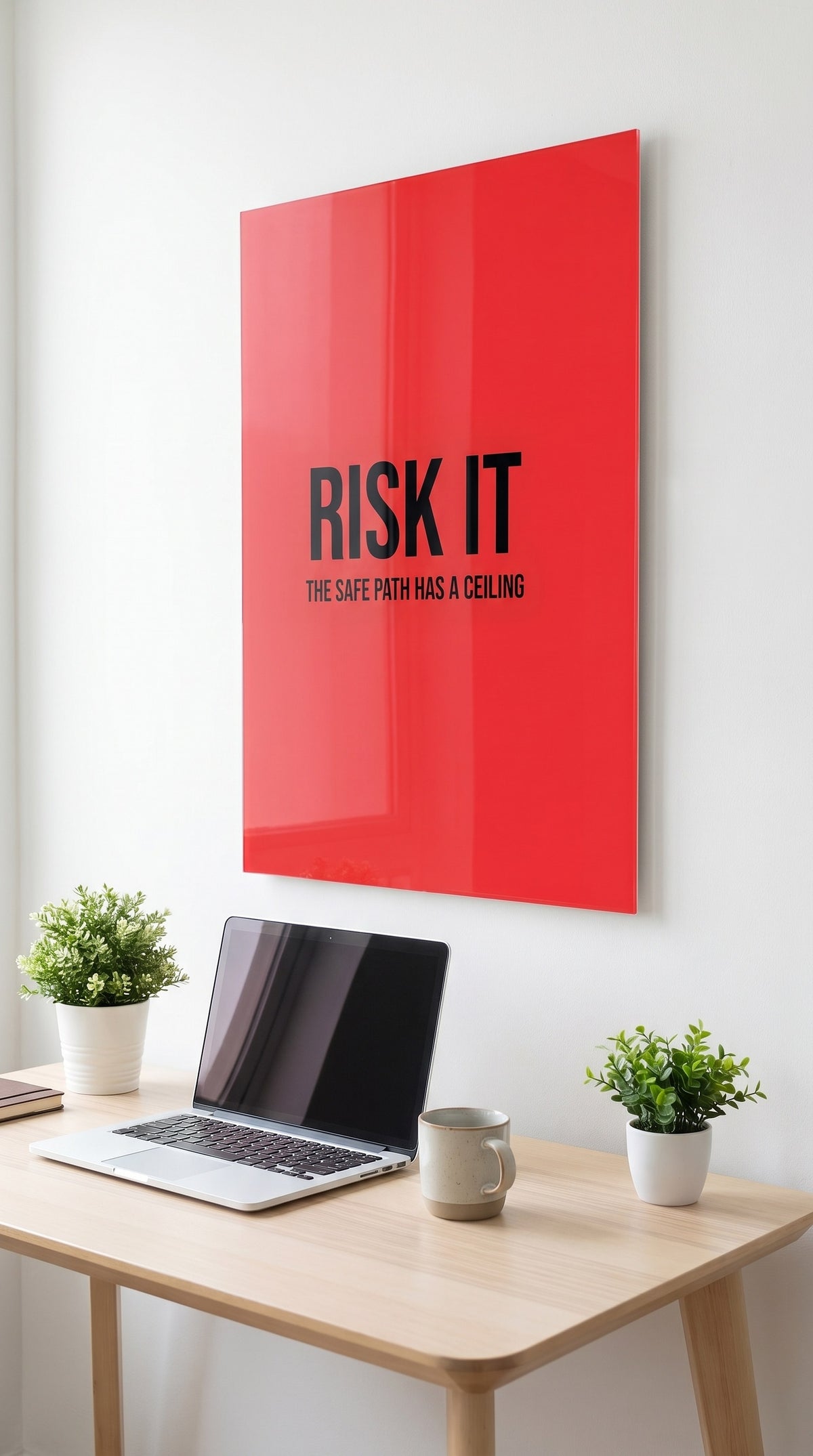 Risk It acrylic sign in a workspace