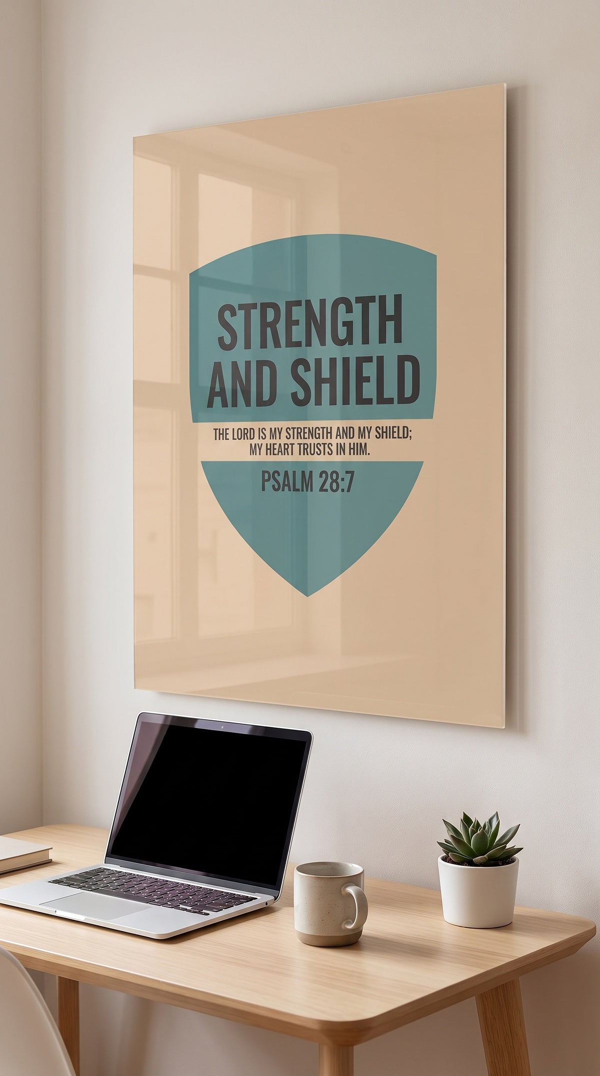 Strength And Shield acrylic sign in a workspace