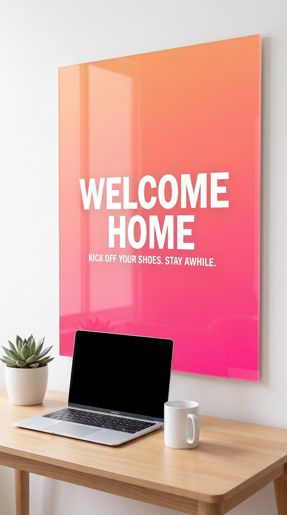 Welcome Home acrylic sign in a workspace