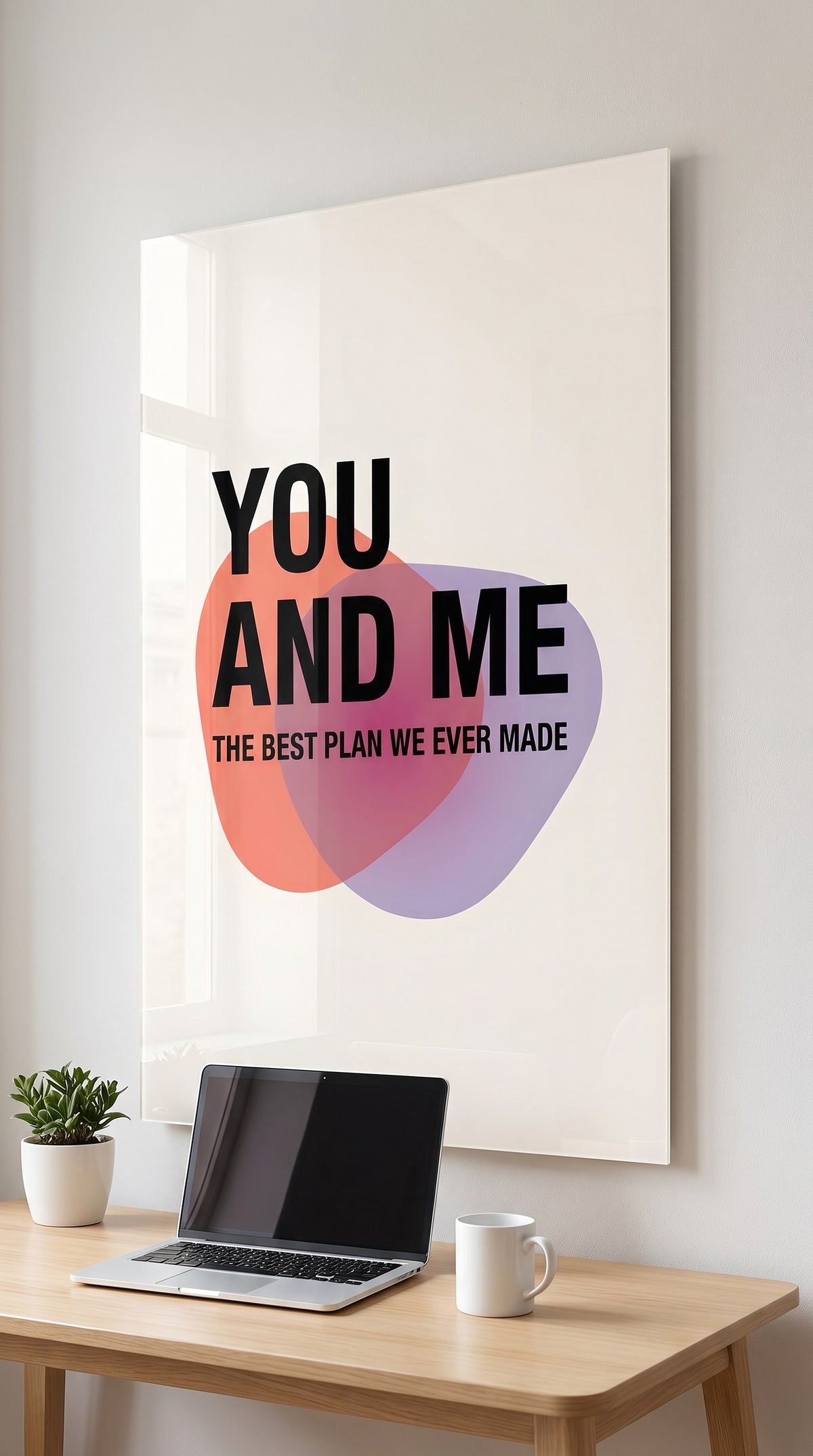 You And Me acrylic sign in a workspace